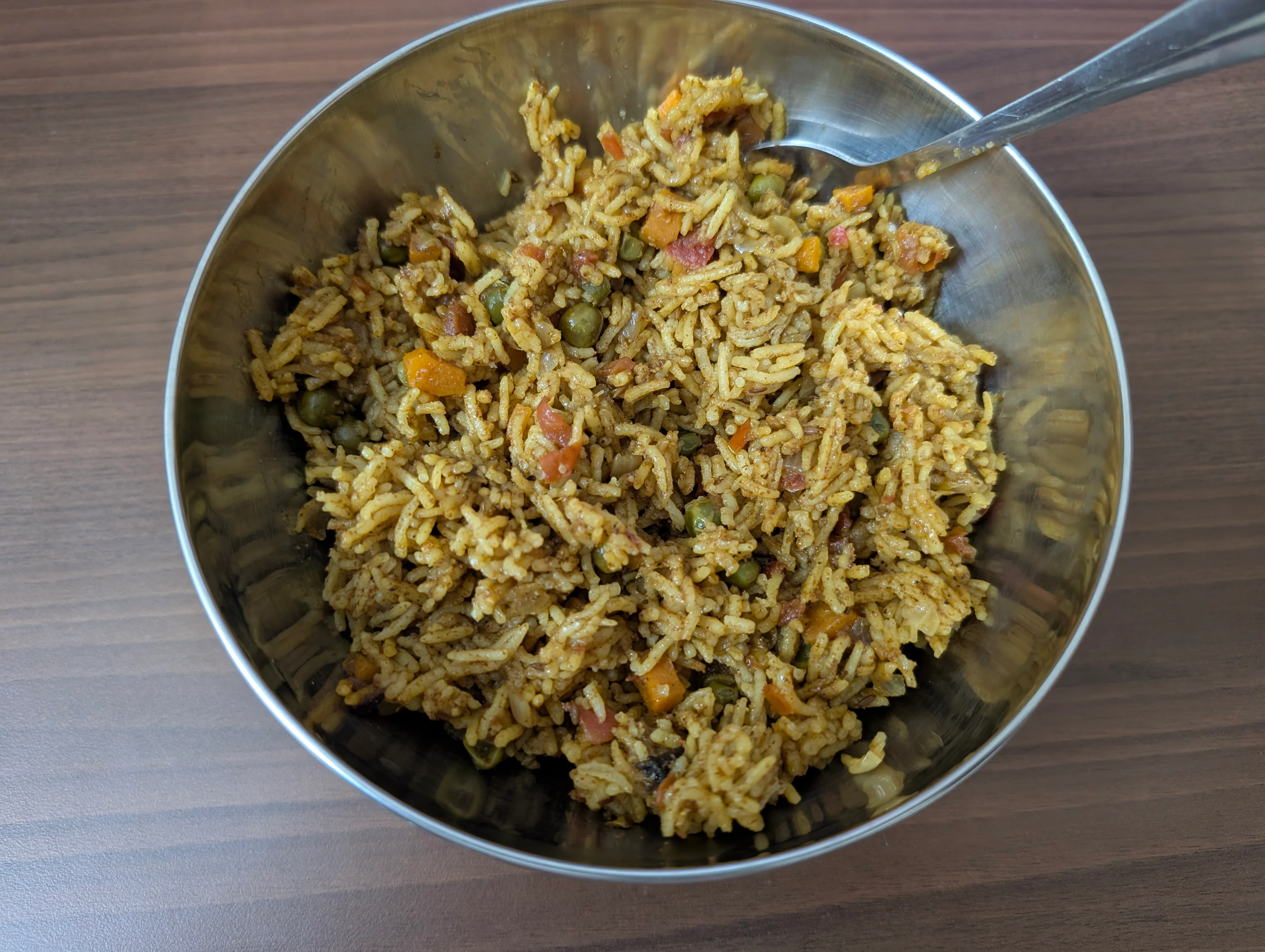 A bowl containing pulav, an Indian rice dish that's typically pressure cooked rice with misc veggies and spices. Ours doesn't look particularly different from what you'd expect, but the flavor was abysmal. We fucked up big time here.
